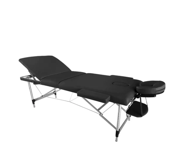 The Karma Bluff is a three-section foldable massage table with lightweight aluminium legs, a raised backrest, and integrated face hole for mobile beauty and massage services.
