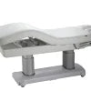 The Karma Hunterville (file 2249-A66.jpg) is a charcoal 4-motor electric beauty bed featuring a dual-column lifting system, adjustable headrest with breath hole, and integrated heating for professional salon treatments.