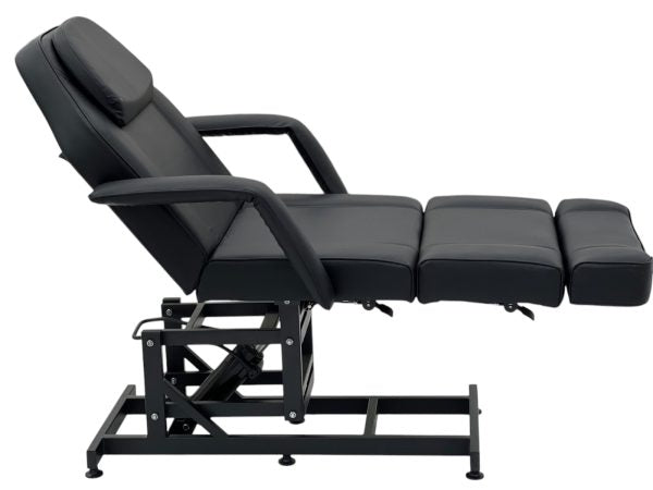 The Karma Taupo is a black hydraulic beauty bed featuring an adjustable back, leg sections, Trendelenburg tilt, and medical-grade antimicrobial vinyl.