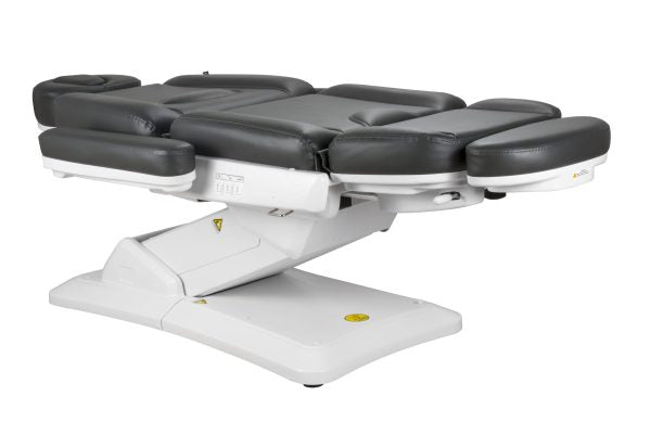 The Karma Christchurch black electric beauty bed featuring a 3-motor system, adjustable face cradle, and antimicrobial vinyl for professional laser and aesthetic treatments.