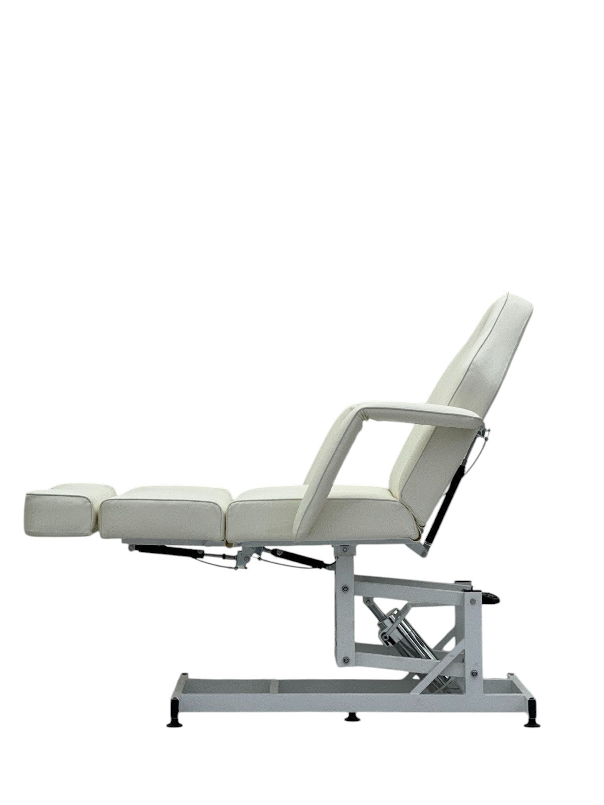 The Karma Taupo is a professional white hydraulic beauty bed featuring adjustable Trendelenburg tilt and antimicrobial vinyl.