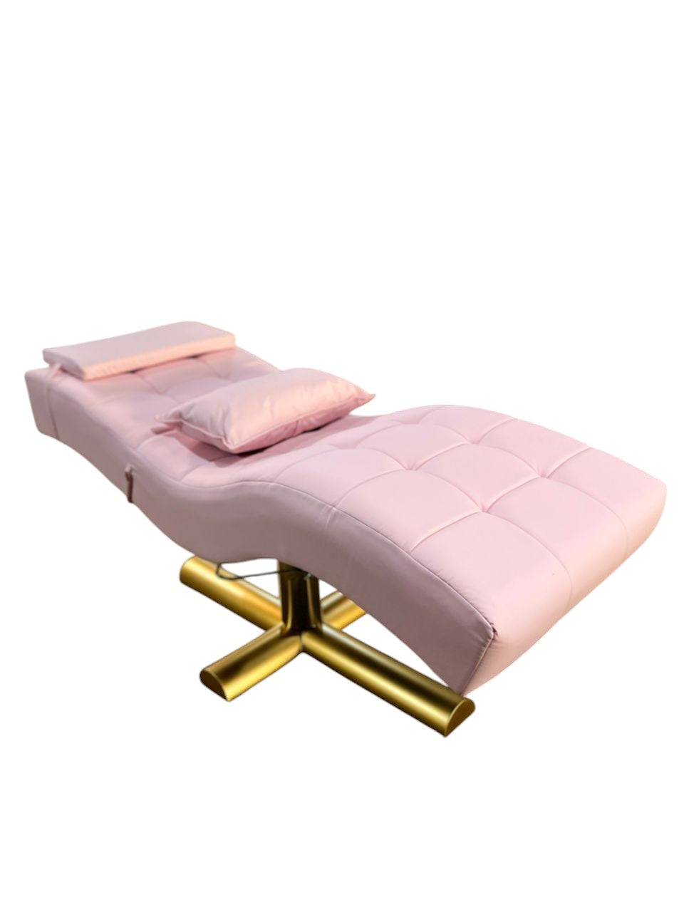 The Karma Wanaka Lash Bed in blush pink tufted vinyl with a modern gold cross-base, designed for ergonomic lash and brow treatments.