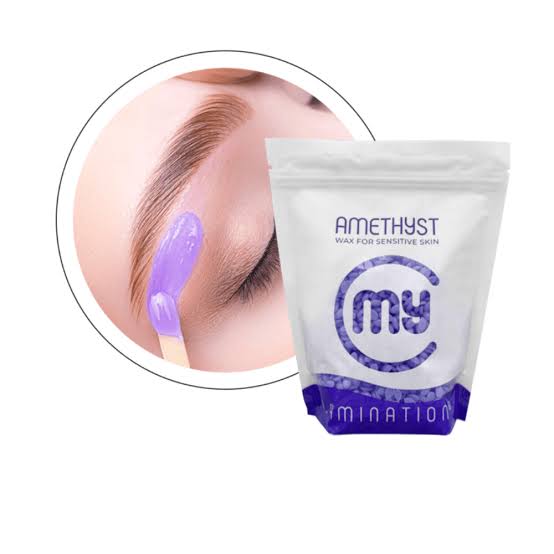 Bag of purple My Lamination Amethyst Brazilian Face Wax beads next to a model receiving a professional eyebrow wax application using a thin, transparent layer.