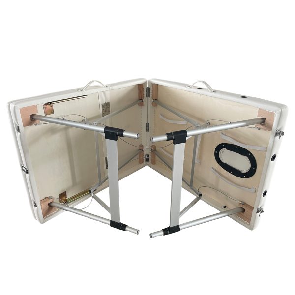 The Karma Bluff is a three-section foldable massage table with lightweight aluminium legs, a raised backrest, and integrated face hole for mobile beauty and massage services.