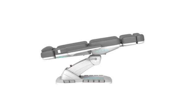 The Karma Queenstown Electric Beauty Bed  in charcoal and white, featuring a pedestal base with LED accents and side control panels for professional medical aesthetic treatments.