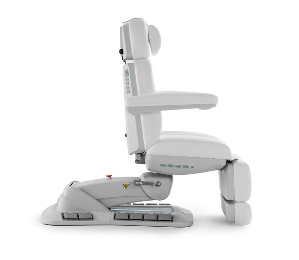The Karma Queenstown Electric Beauty Bed  in charcoal and white, featuring a pedestal base with LED accents and side control panels for professional medical aesthetic treatments.