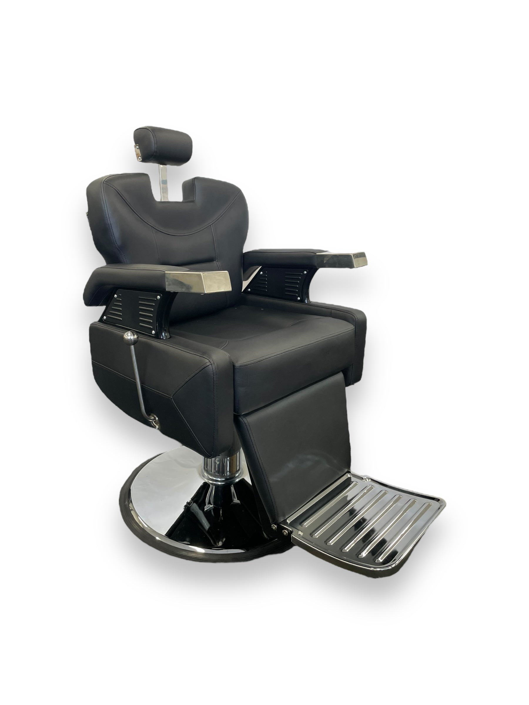 The Karma Runcorn is a reclining black barber chair featuring a heavy-duty chrome hydraulic base, adjustable headrest, and ergonomic footrest.