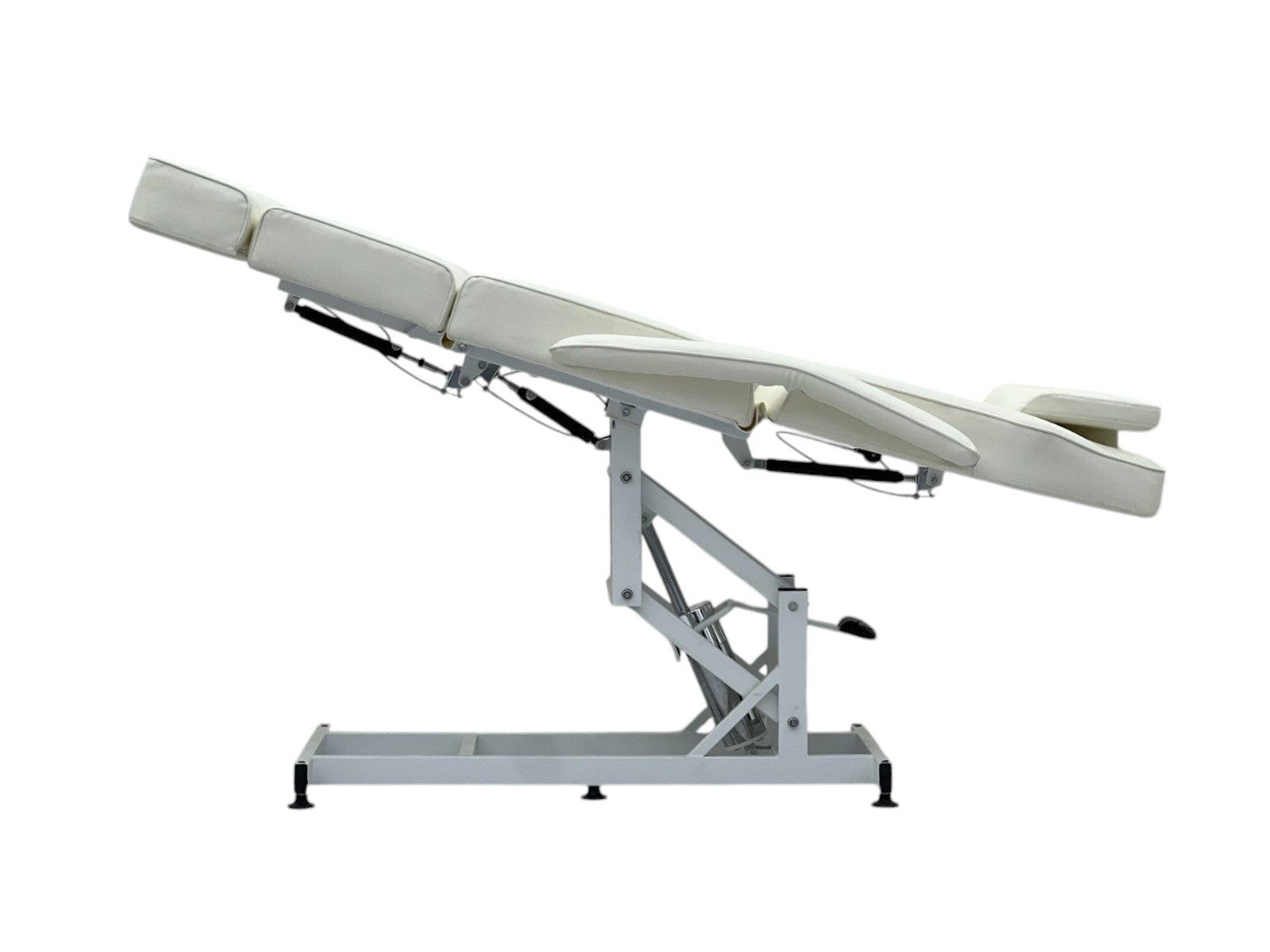 The Karma Taupo is a professional white hydraulic beauty bed featuring adjustable Trendelenburg tilt and antimicrobial vinyl.