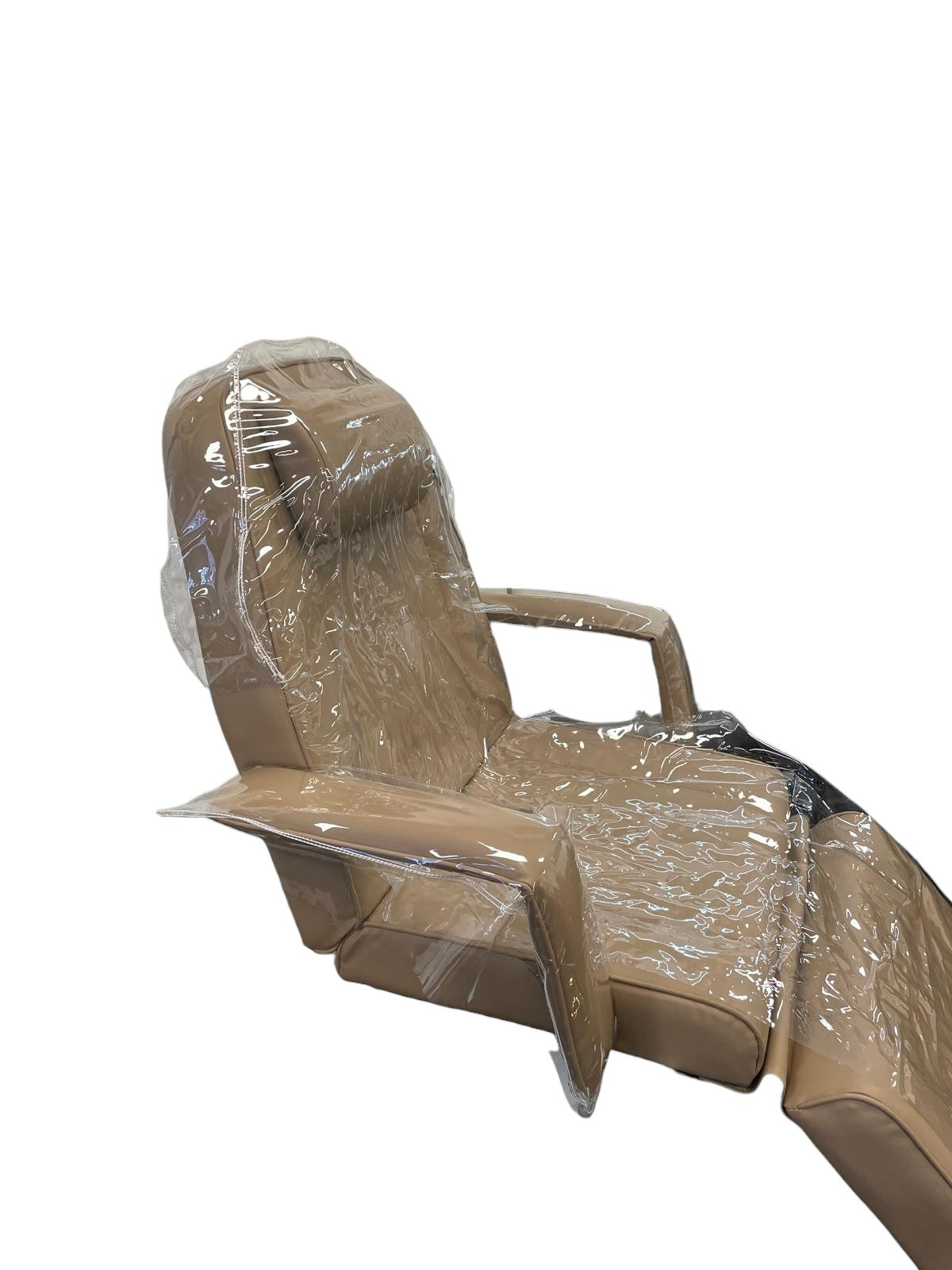 The Karma Universal Plastic Bed Cover  is a clear, 3-piece waterproof protector set fitted over a white electric treatment bed, showing headpiece, main body, and arm covers.