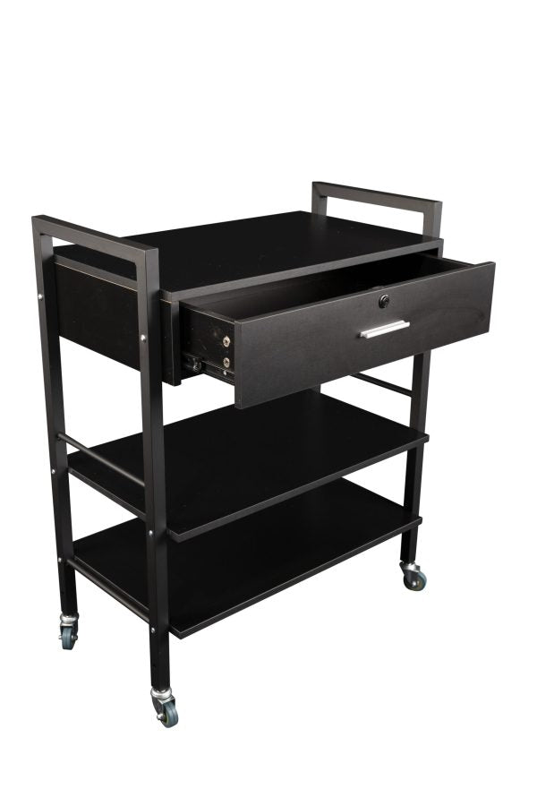The Karma Driver Beauty Trolley in a sleek black powder-coated finish, featuring two spacious shelves, a melamine storage drawer with glides, and high-quality rubber castors.
