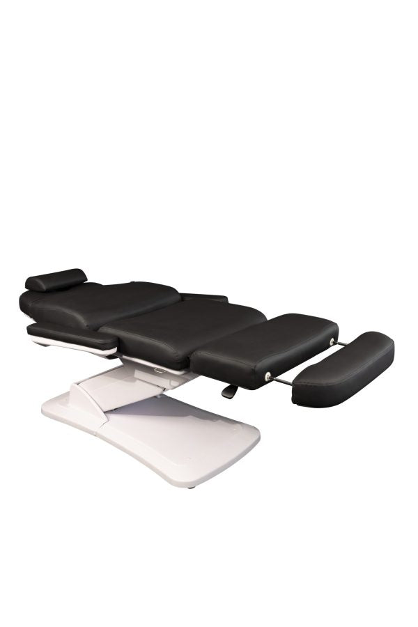 The Karma Dunedin is a premium sand electric beauty bed featuring three motors, an adjustable headrest with a face hole, and medical-grade antimicrobial vinyl.