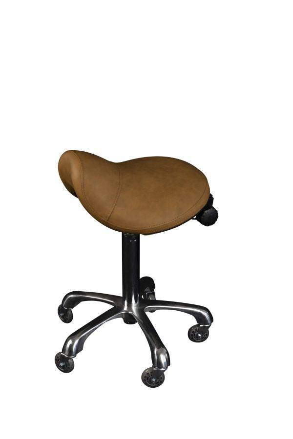 The Karma Evandale Saddle Stool features a contoured tan saddle seat, a polished aluminium base, and specialized hair-free rollerblade wheels.