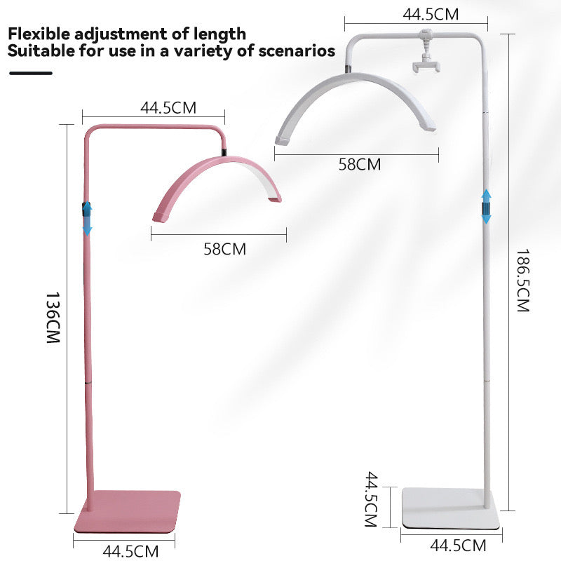 The Karma Half Moon Beauty Light  is a 23-inch curved arc floor lamp featuring a low-profile flat base and an adjustable telescopic stand.