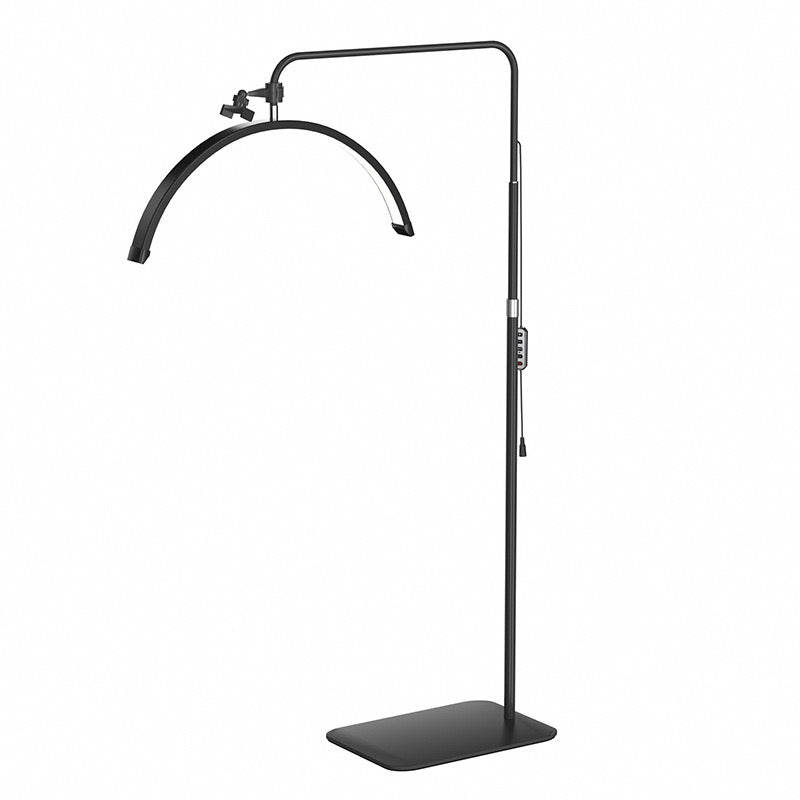 The Karma Half Moon Beauty Light  is a black 23-inch curved arc floor lamp featuring a low-profile flat base and an adjustable telescopic stand.