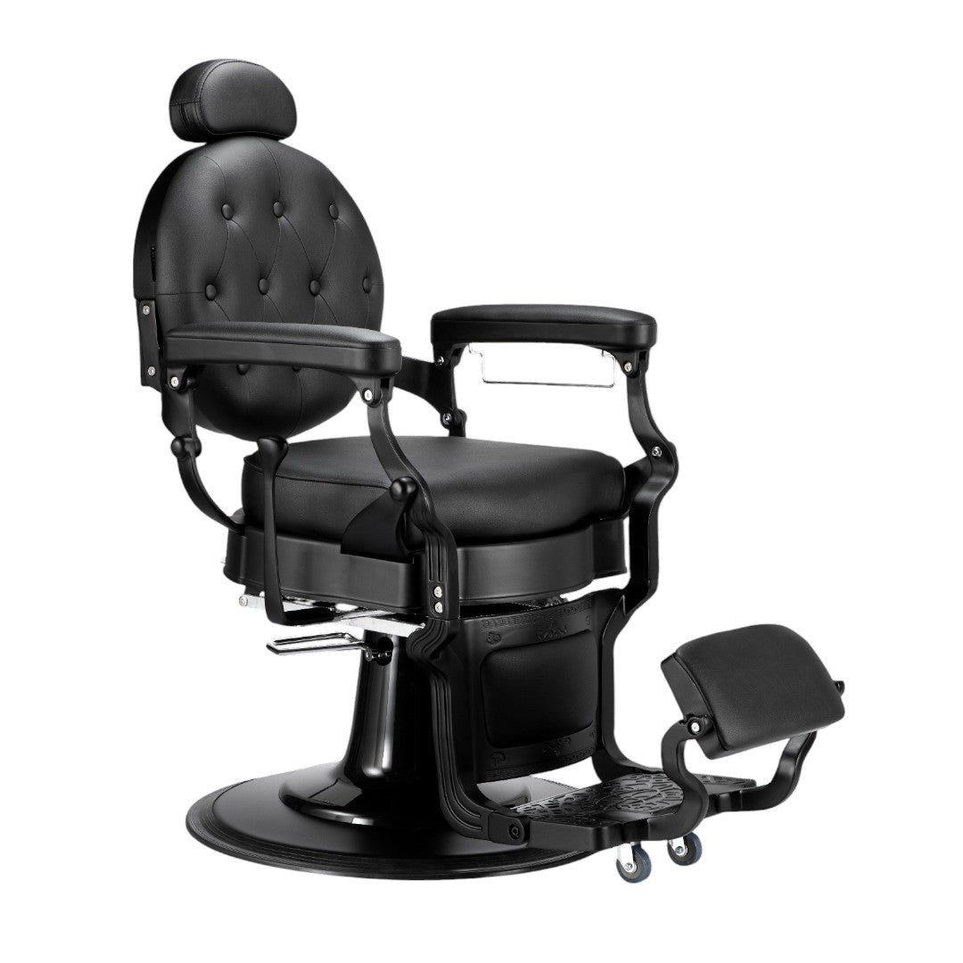 The Karma Mackay Barber Chair features a vintage tufted matte black leatherette finish with a heavy-duty hydraulic base and reclining backrest.