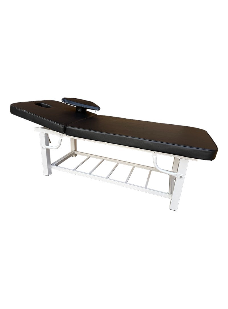 The Karma Napier Beauty Bed, featuring a raised backrest, removable face pillow, and a heavy-duty white steel frame with an integrated storage rack.