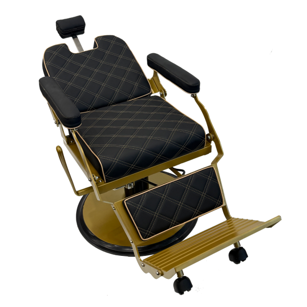 The Karma Paddington barber chair  features black diamond-quilted upholstery with gold-finished hardware and a heavy-duty hydraulic base.