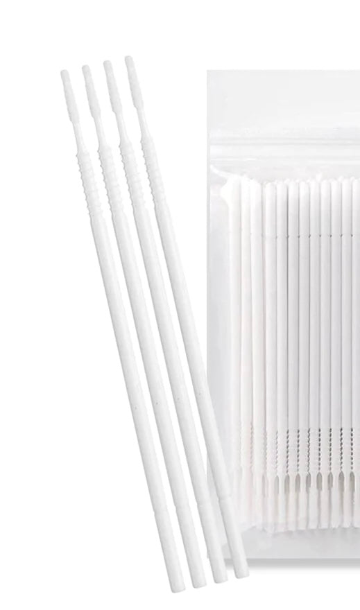A professional pack of white microbrush applicators featuring extra-long lint-free tips designed for fast and precise chemical application during lash lifts.