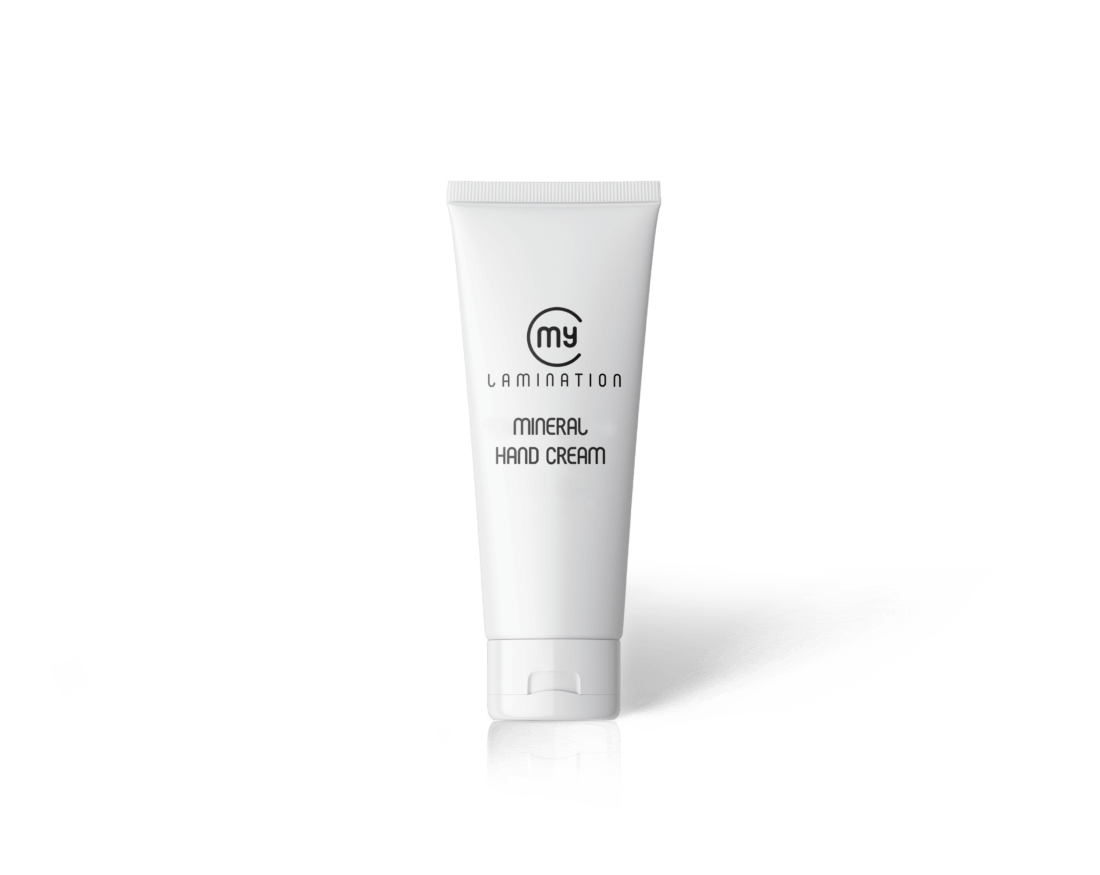 A 75ml tube of My Lamination Mineral Hand Cream next to a close-up of the creamy white texture being applied to a therapist's hand, highlighting its rapid absorption.