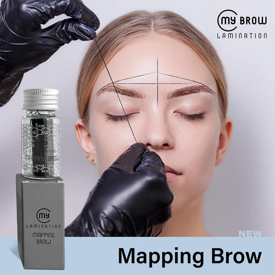 Professional My Lamination Mapping Brow string in a glass vial, showing a therapist using the pre-inked black thread to create symmetrical mapping lines on a client's forehead.